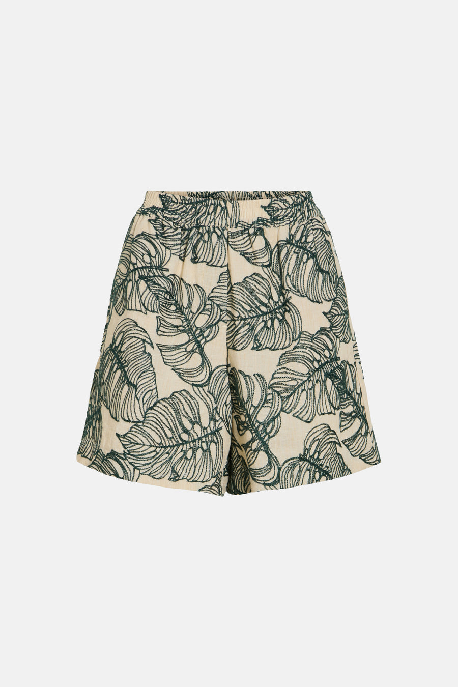Crèmekleurige shorts met groene bladprint van VILA® en elastische taille, platliggend gefotografeerd.