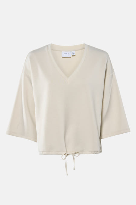 Beige sweater van VILA met korte mouwen en een trekkoord aan de onderkant.
