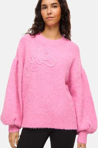 Roze trui met ronde hals van VILA®, met een geborduurde bloem op de borst en ballonmouwen.
