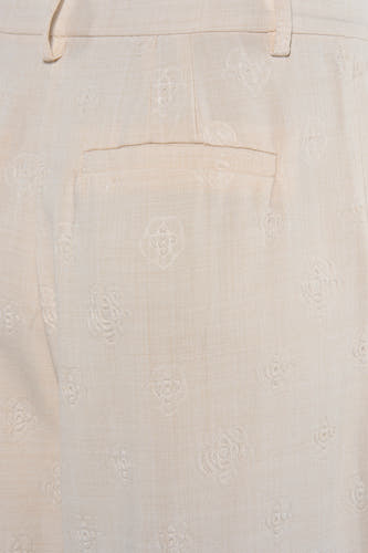 Pantalon beige de VILA®, avec motif rose subtil et une poche arrière.