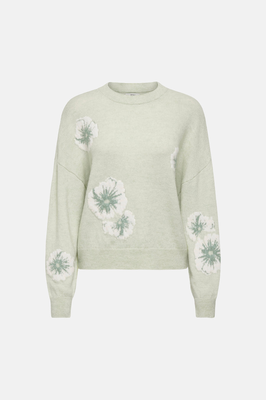Groene trui met ronde hals van JDY, versierd met witte bloemmotieven.
