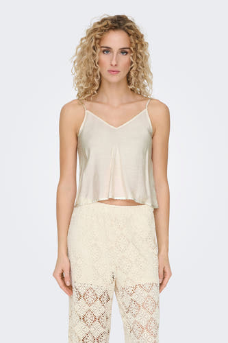 Ecru mouwloze blouse van ONLY, met fijne spaghettibandjes en een licht golvend model.
