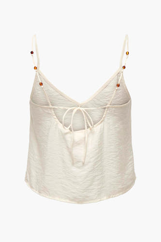 Ecru mouwloze blouse van ONLY, met fijne textuur en bandjes met kraaldetails.
