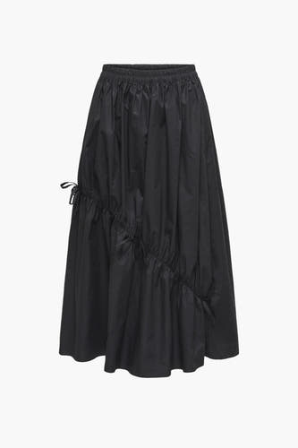 Zwarte rok van JDY, met elastische tailleband en decoratieve strikdetails aan de zijkant.