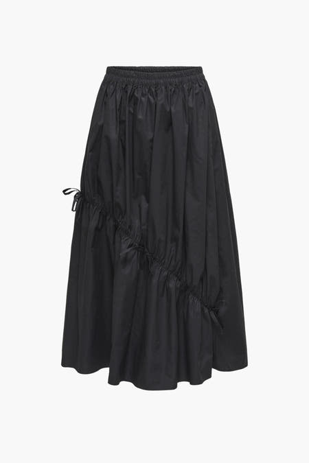 Zwarte rok van JDY, met elastische tailleband en decoratieve strikdetails aan de zijkant.