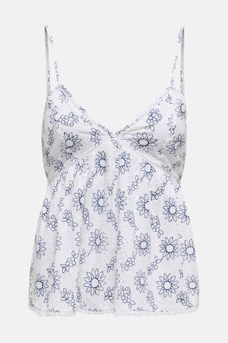 Witte mouwloze blouse van ONLY, met blauwe bloemenprint en kanten details.
