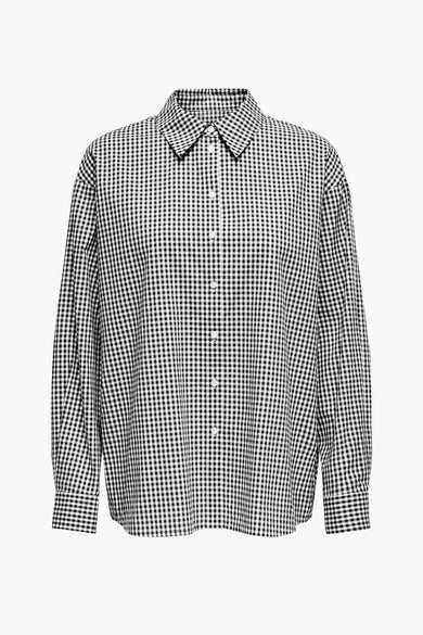 Zwart overhemd met lange mouwen van ONLY, met een zwart-wit geruit patroon en knoopsluiting.
