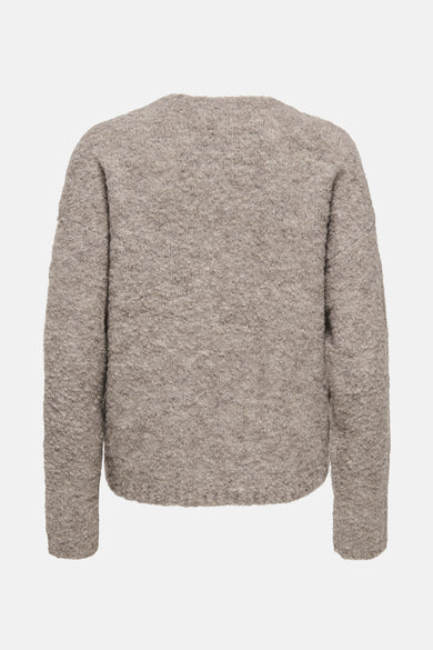 Gilet rond de cou cou beige ONLY, avec une texture grossière tr tricotée.