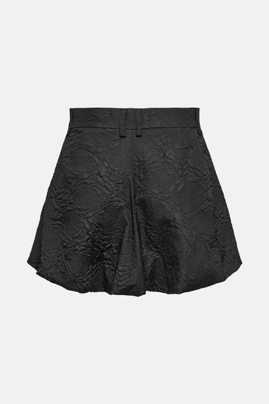 Jupe courte noire d'ONLY, avec une texture de relief de motifs circulaires sur toute la surface.