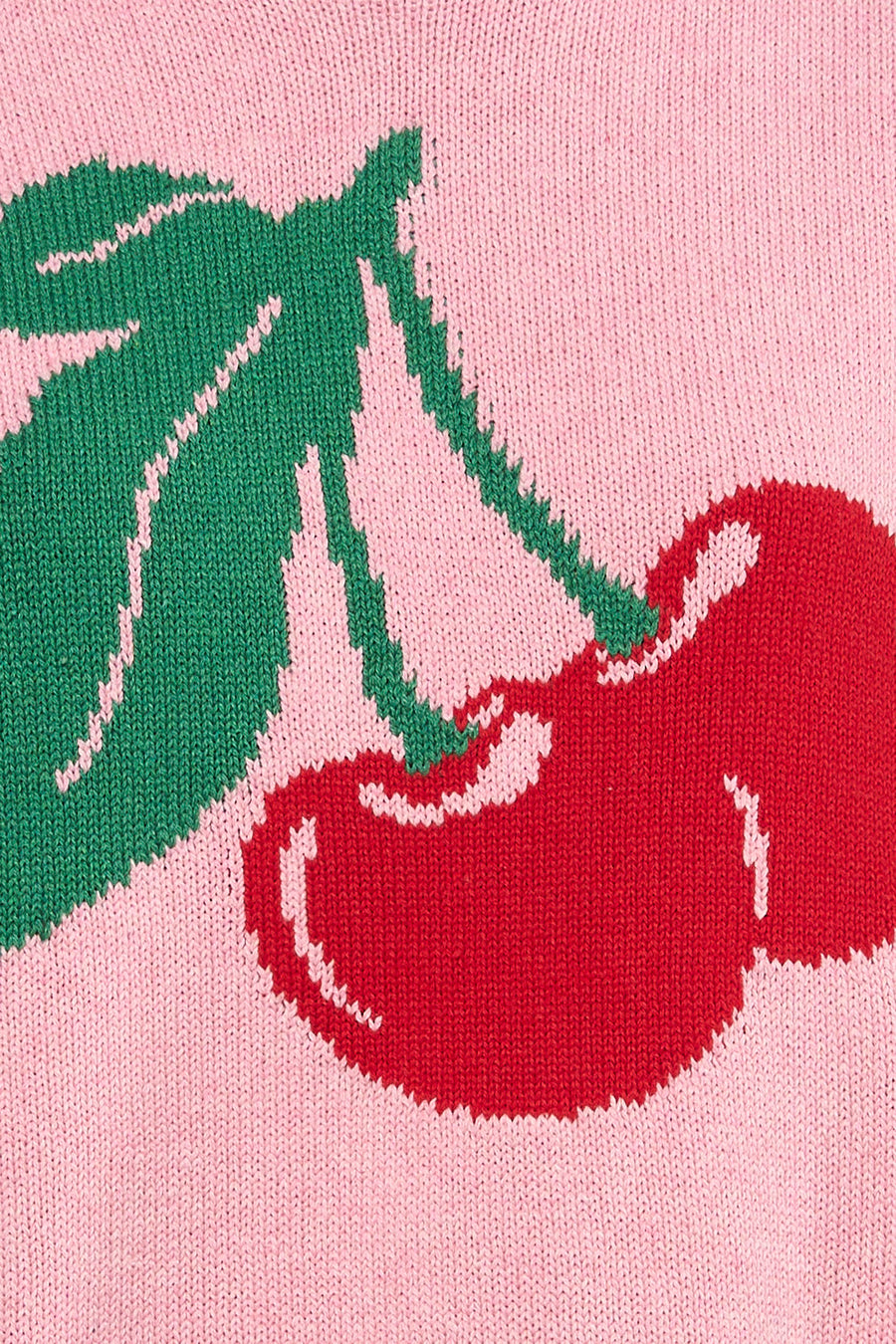 Pull rose à col rond de ONLY®, avec texture tricotée et motif cerise.