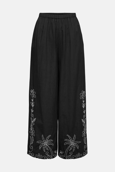 Zwarte broek van JDY, met geborduurde palmboomdetails aan de zijkanten.