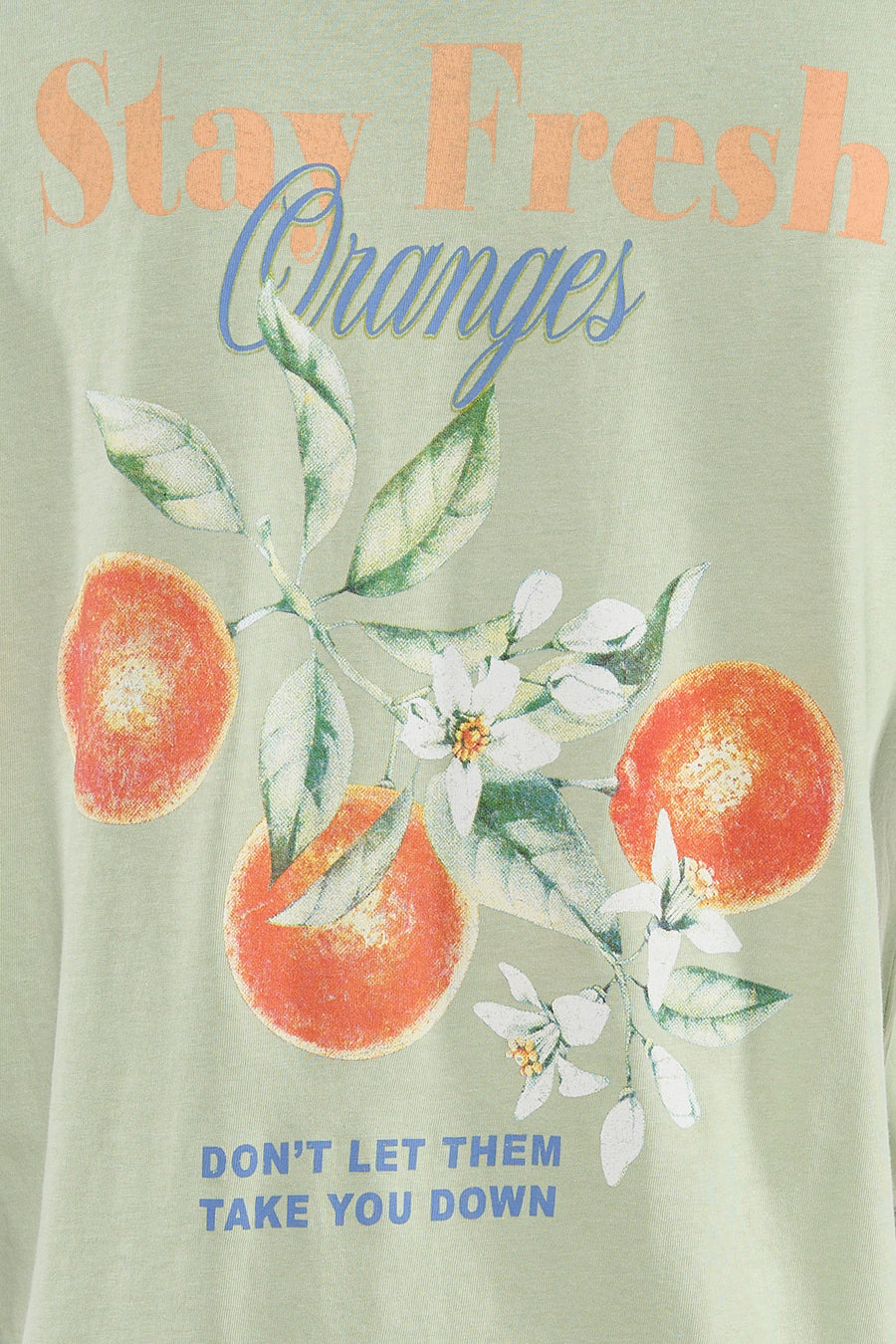 T-shirt à manches courtes vert de ONLY, avec imprimé d'oranges et de fleurs.