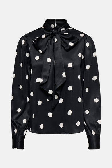 Zwarte blouse met lange mouwen van ONLY, met witte stippen en een decoratieve strik.
