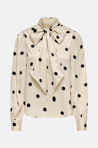 Ecru blouse met lange mouwen van ONLY, met zwarte stippen en een strikdetail bij de kraag.
