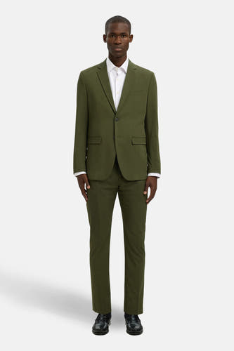 Groene blazer van SELECTED, gedragen met een wit overhemd en zwarte schoenen.