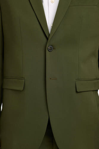Groene blazer van SELECTED, met een enkele knoopsluiting en paspelzakken.