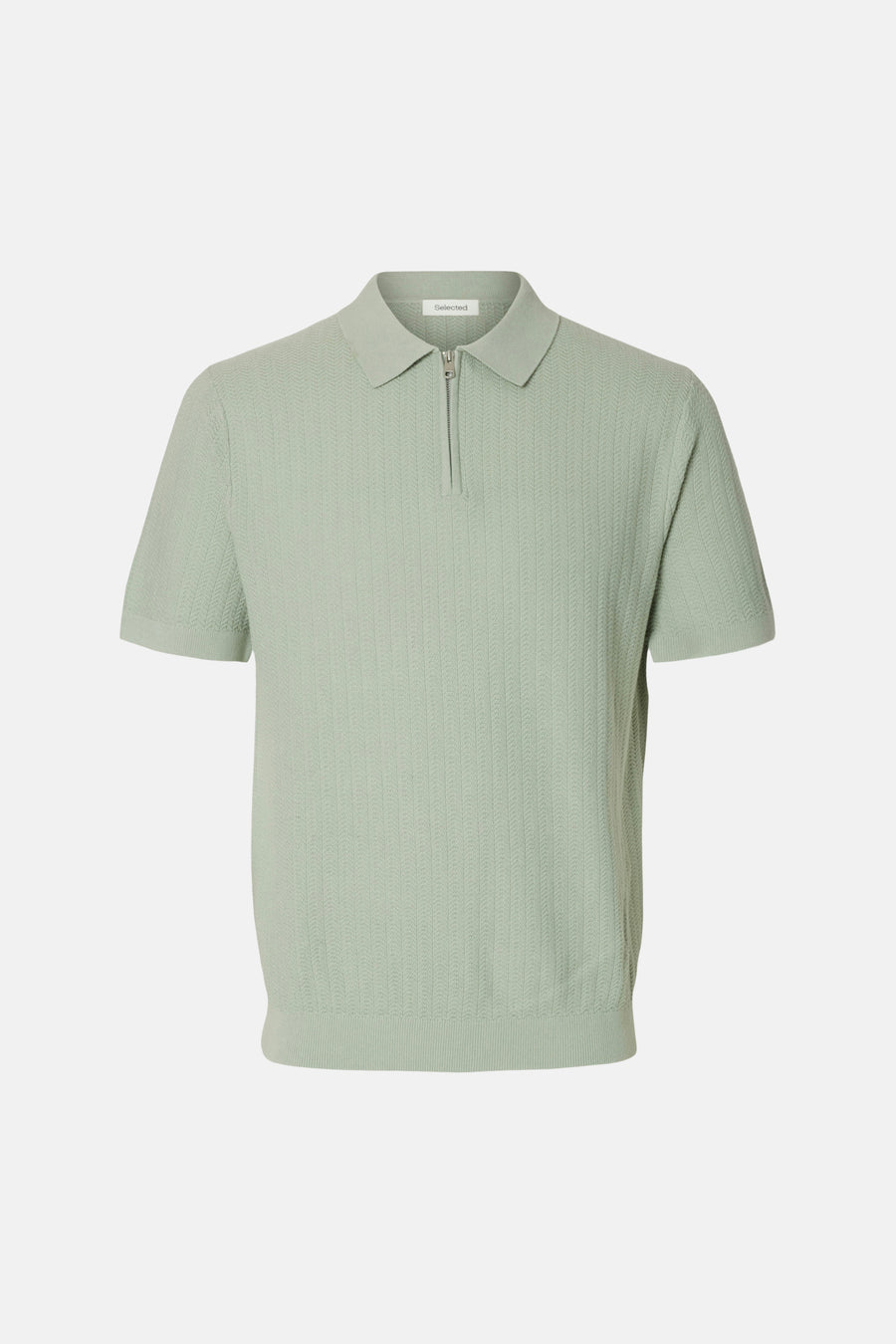 Polo verte Selected de couleur verte à manches courtes et à la texture fine.