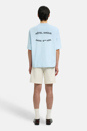 T-shirt bleu à manches courtes de SELECTED, avec texte noir au dos.