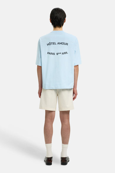T-shirt bleu à manches courtes de SELECTED, avec texte noir au dos.
