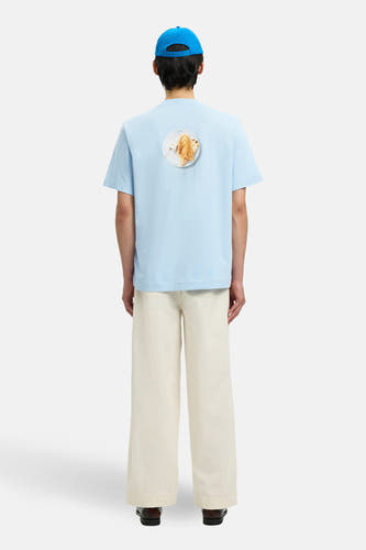 T-shirt à manches courtes bleu de SELECTED, avec un imprimé d'une planche à toasts au dos.