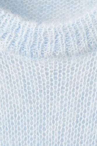 T-shirt bleu avec col rond de MANGO, en tissu tricoté ouvert et finition cotonneuse.