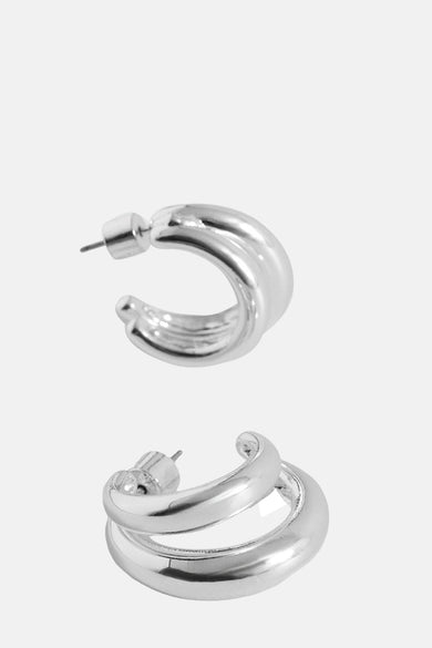 Boucles d'oreilles en argent de MANGO, avec une double bague et un fini lisse et brillant.