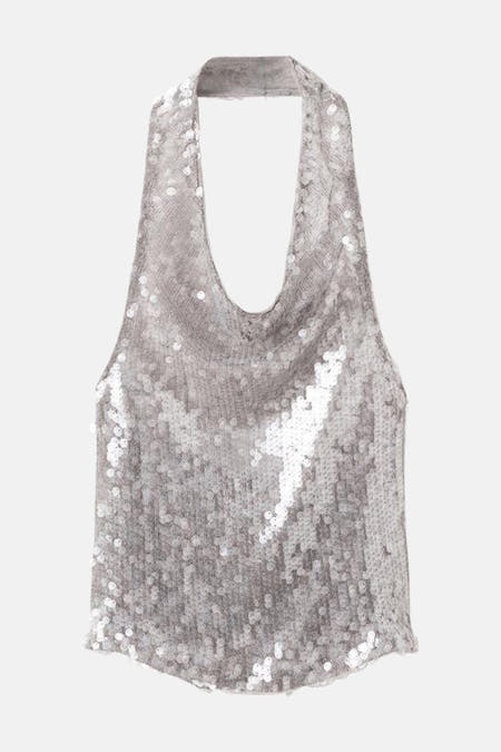 Zilverkleurige blouse zonder mouwen van MANGO, geheel bedekt met glanzende pailletten voor een feestelijke textuur.
