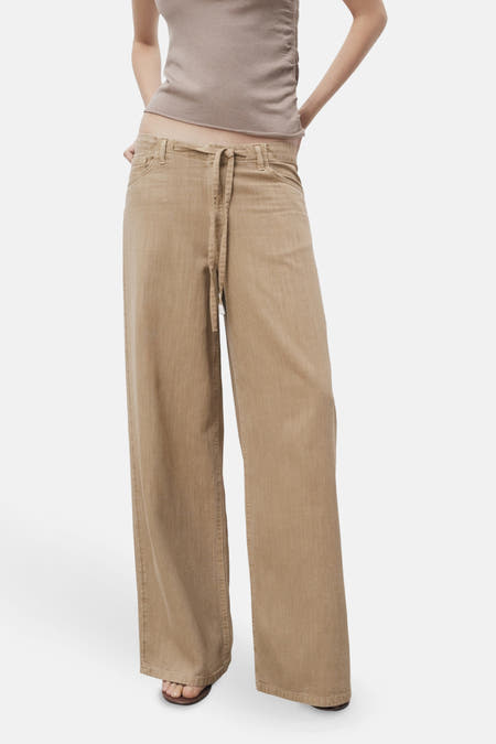 Beige gekleurde jeans van MANGO, met een trekkoord in de taille en wijde pijpen.