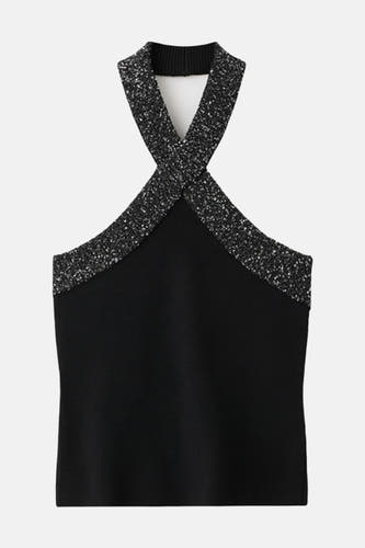 Zwarte mouwloze blouse van MANGO, met gekruiste glitterende banden en een opstaande kraag.