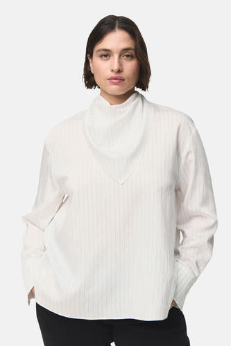 Witte blouse met lange mouwen van MANGO, met subtiele verticale strepen en een losse pasvorm.
