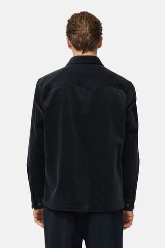Veste courte bleue de MANGO, texture velours côtelé, vue de dos.