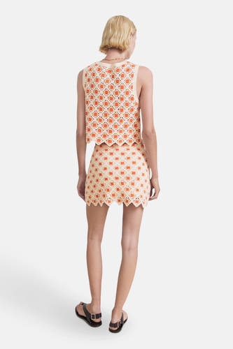 Korte rok multicolor van MANGO, met gehaakt bloempatroon en een decoratieve geschulpte rand.
