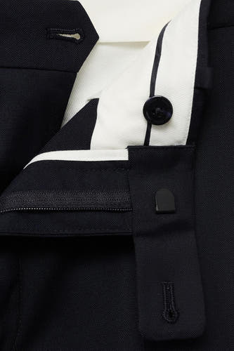 Pantalon de costume bleu MANGOANGO, avec ce ce taille et et et boutonnière, coupé.