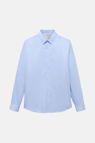 Chemise bleue à manches longues de MANGO, unie et avec une col classique.