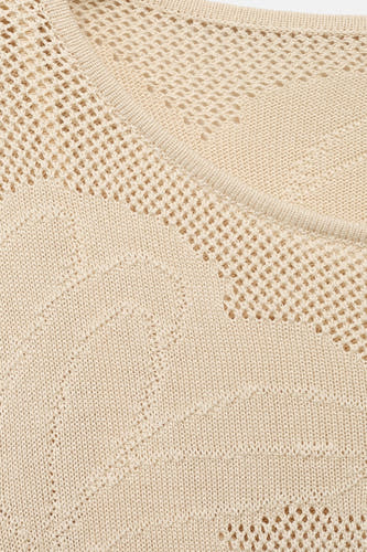Manteau beige à longues manches de MANGO, avec des détails tricotés et une texture tissée ouverte.