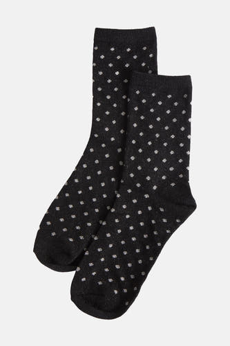 Zwarte sokken van PIECES® met een zilverkleurig stippenpatroon en glanzende textuur.
