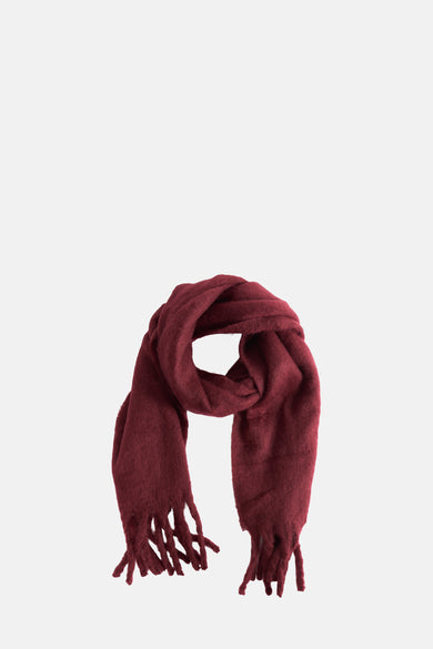 Jalouse de hiver Bordeaux de PIECES®, présenté roulé avec des bords froncés.
