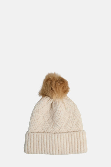 Chapeau beige de PIECES avec un bord côtelé et des pompons décoratifs.