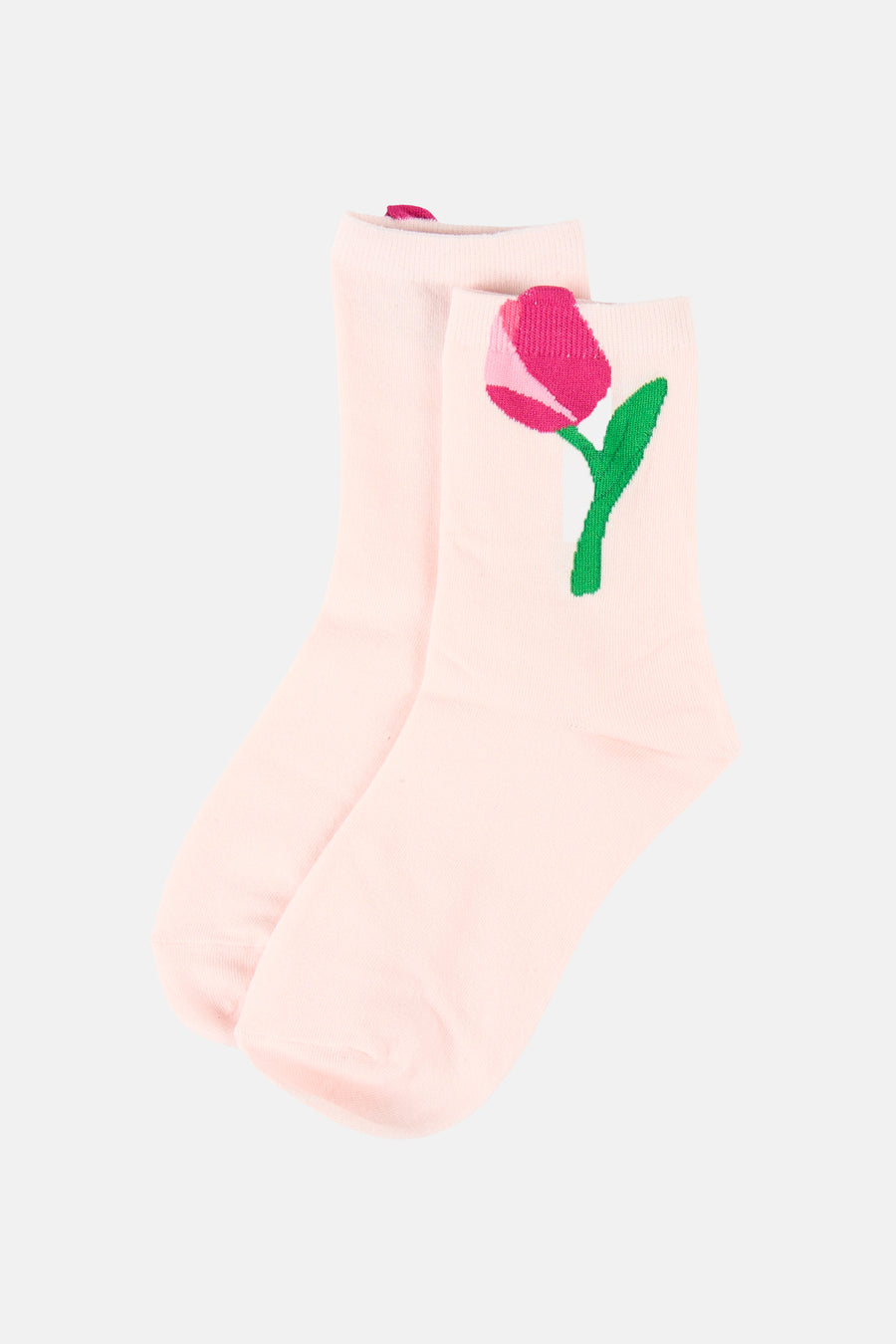 Chaussettes roses de PIECES® avec une tulipe rose brodée et une tige verte.