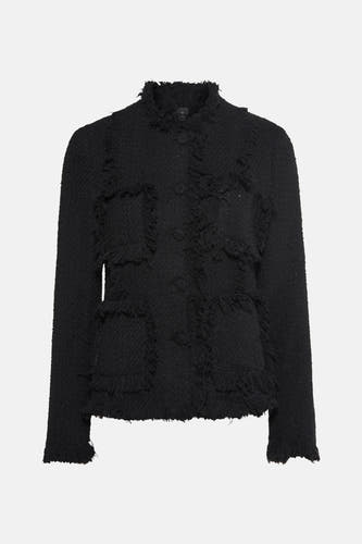 Blazer noir de MANGO avec des manches longues et une texture froncée.
