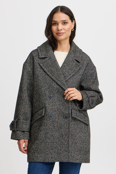 Manteau long noir de France, avec un motif à carreaux et une fermeture à double bouton.