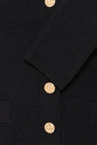 Veste noire de Fransa, avec des manches longues et des boutons dorés.