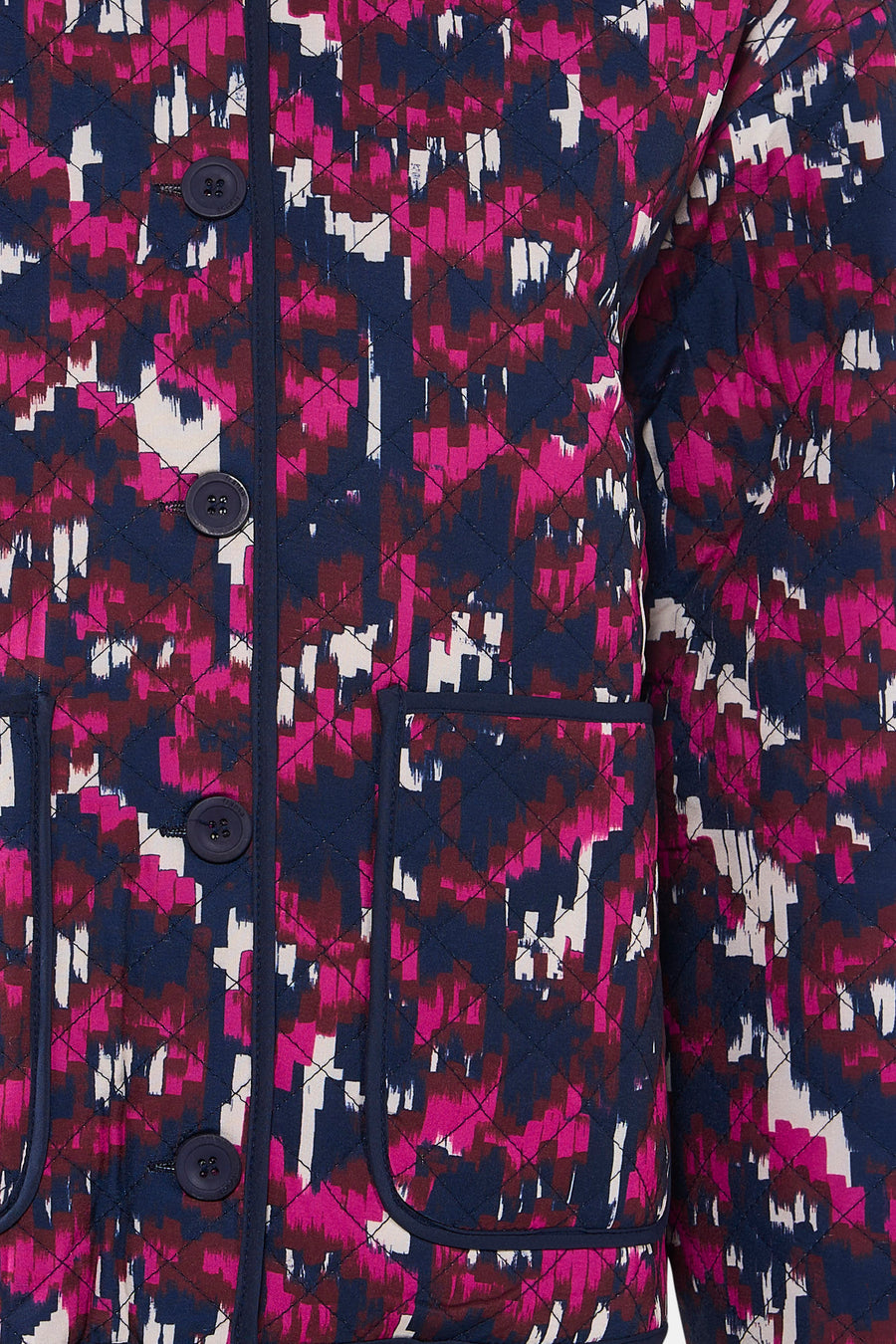Manteau court multicolore de France, avec un motif abstrait, une fermeture à boutons et des poches brodées.