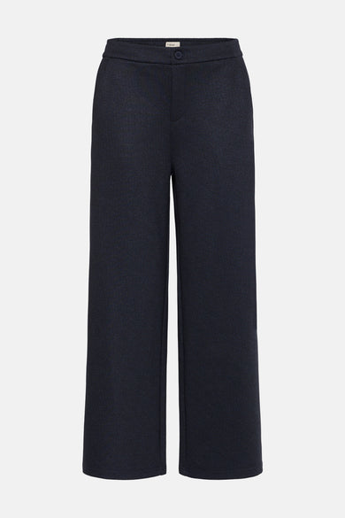 Pantalon bleu de France, avec une ceinture élastique et des jambes larges.