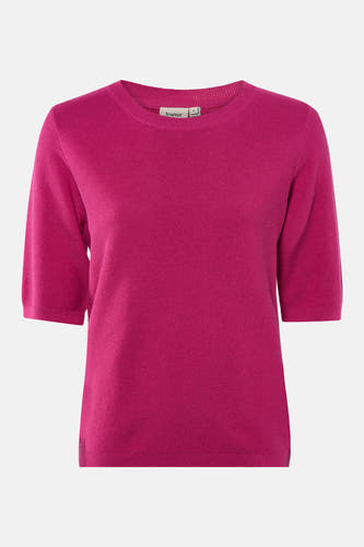 Blouse rose avec col rond de France, fine texture.
