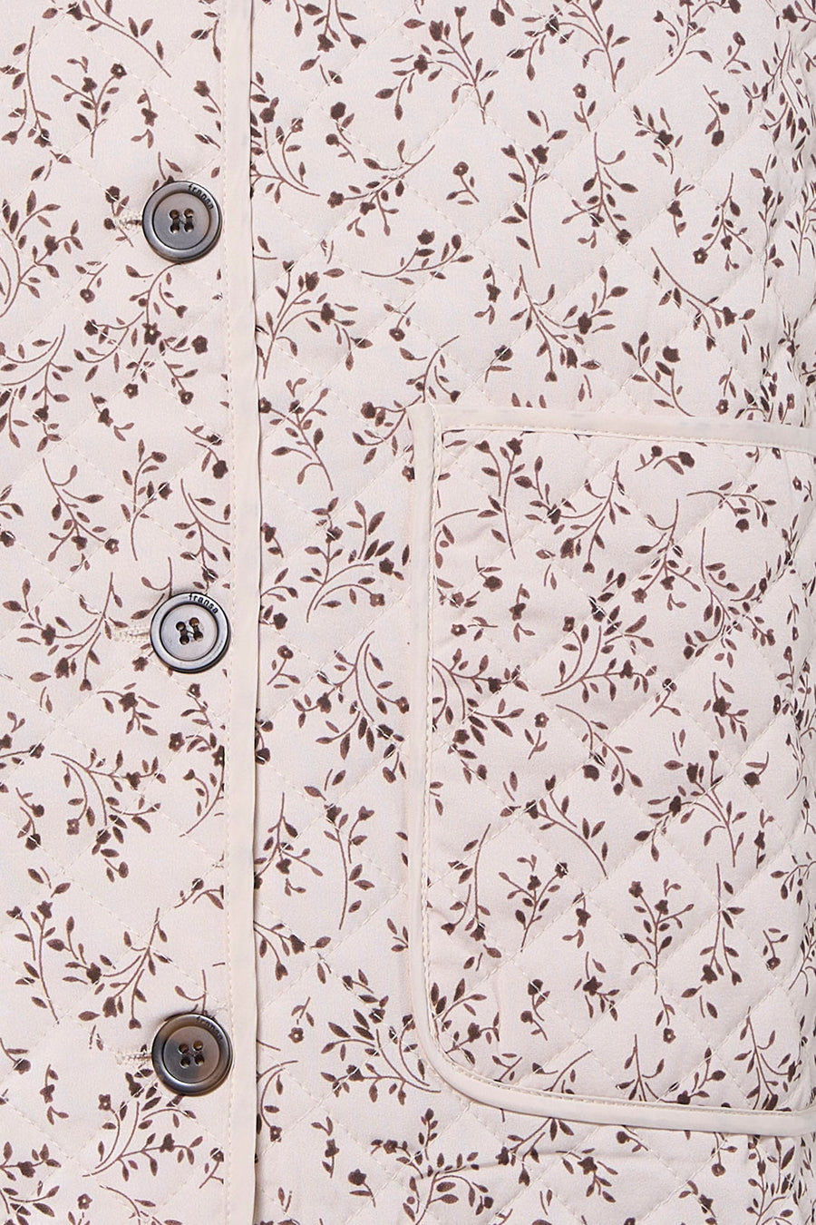 Ecru bodywarmer van Fransa, met een bloemenmotief en een diamantvormig stikselpatroon, en knopen.
