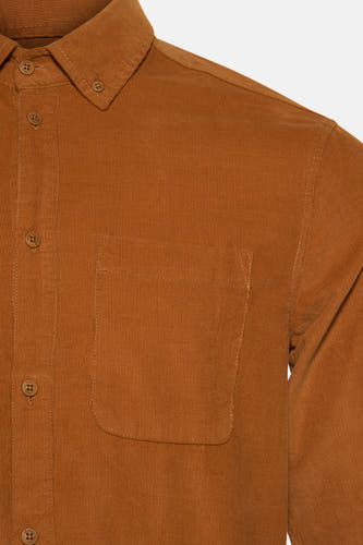 Chemise en corduroy orange à longues manches de SOLID, avec fermeture à boutons et poche poitrine.