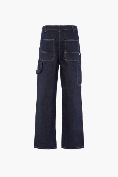 Donkerblauwe wide jeans van SOLID, met gereedschapszak en achterzakken met stiksels, van achteren gezien.