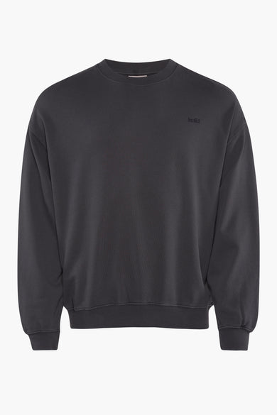 Gilet noir de SOLID, gros plan de la manche avec bord côte.