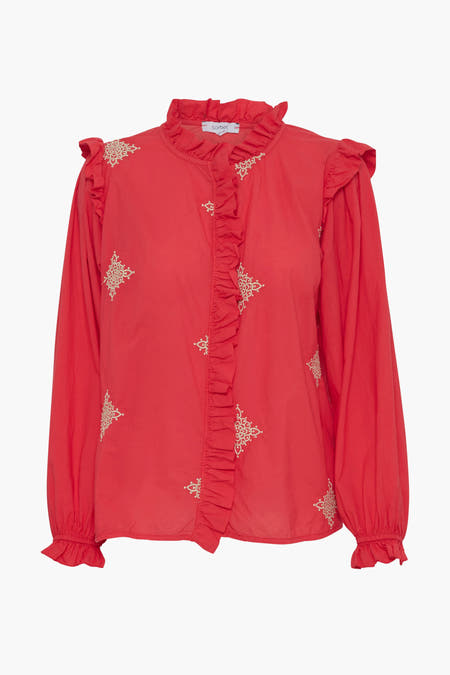 Chemise rose à longues manches de Sorbet, avec des plis et des détails brodés.